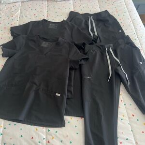 FIGS black scrubs Size Medium. 2 pairs.